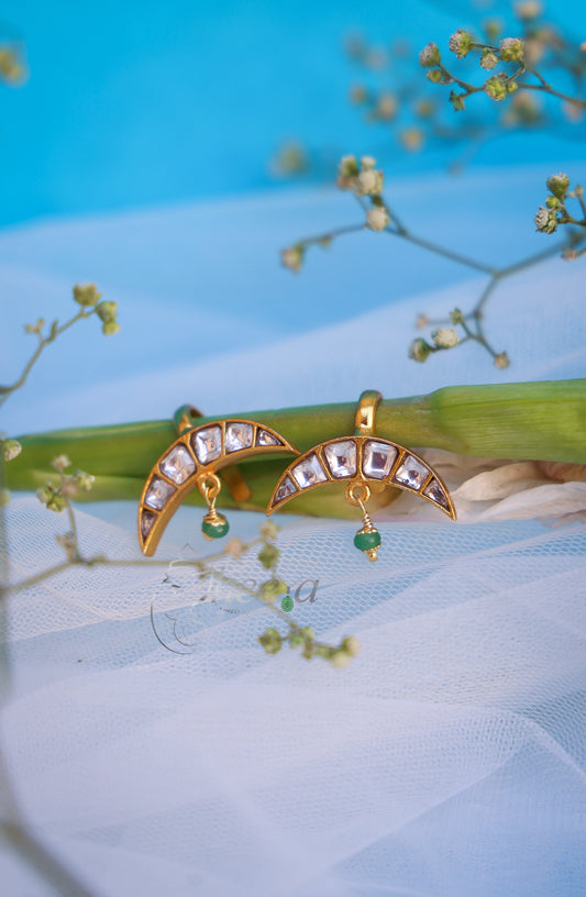 White stone half moon with green drop