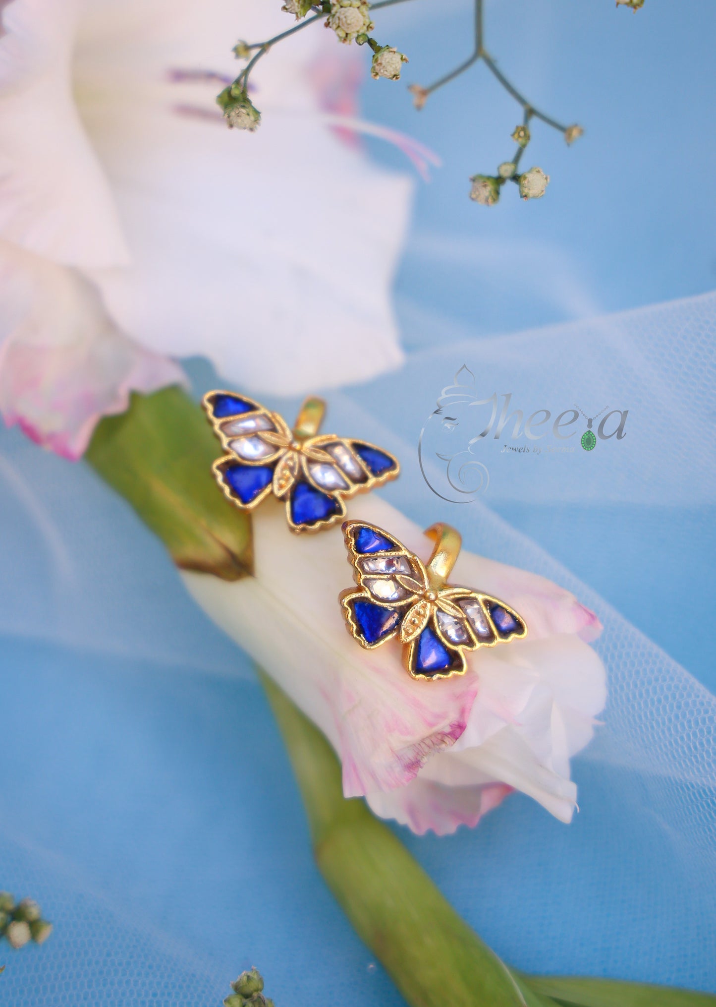 Blue and white butterfly bugadi