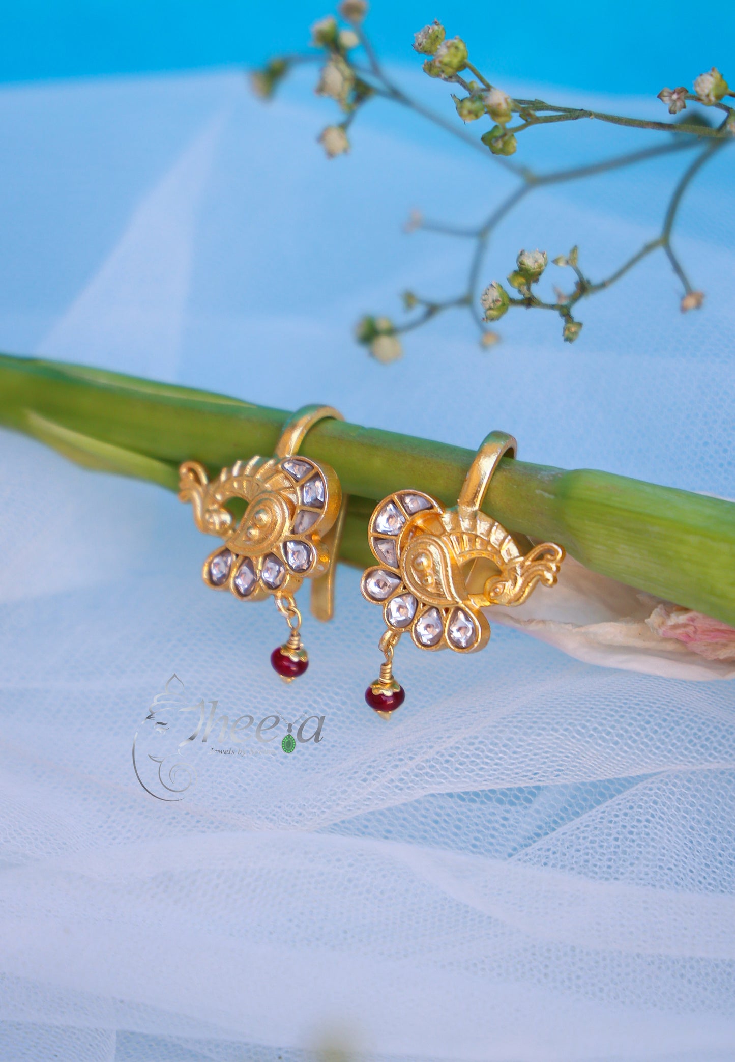 White stone peacock with red bead bugadi