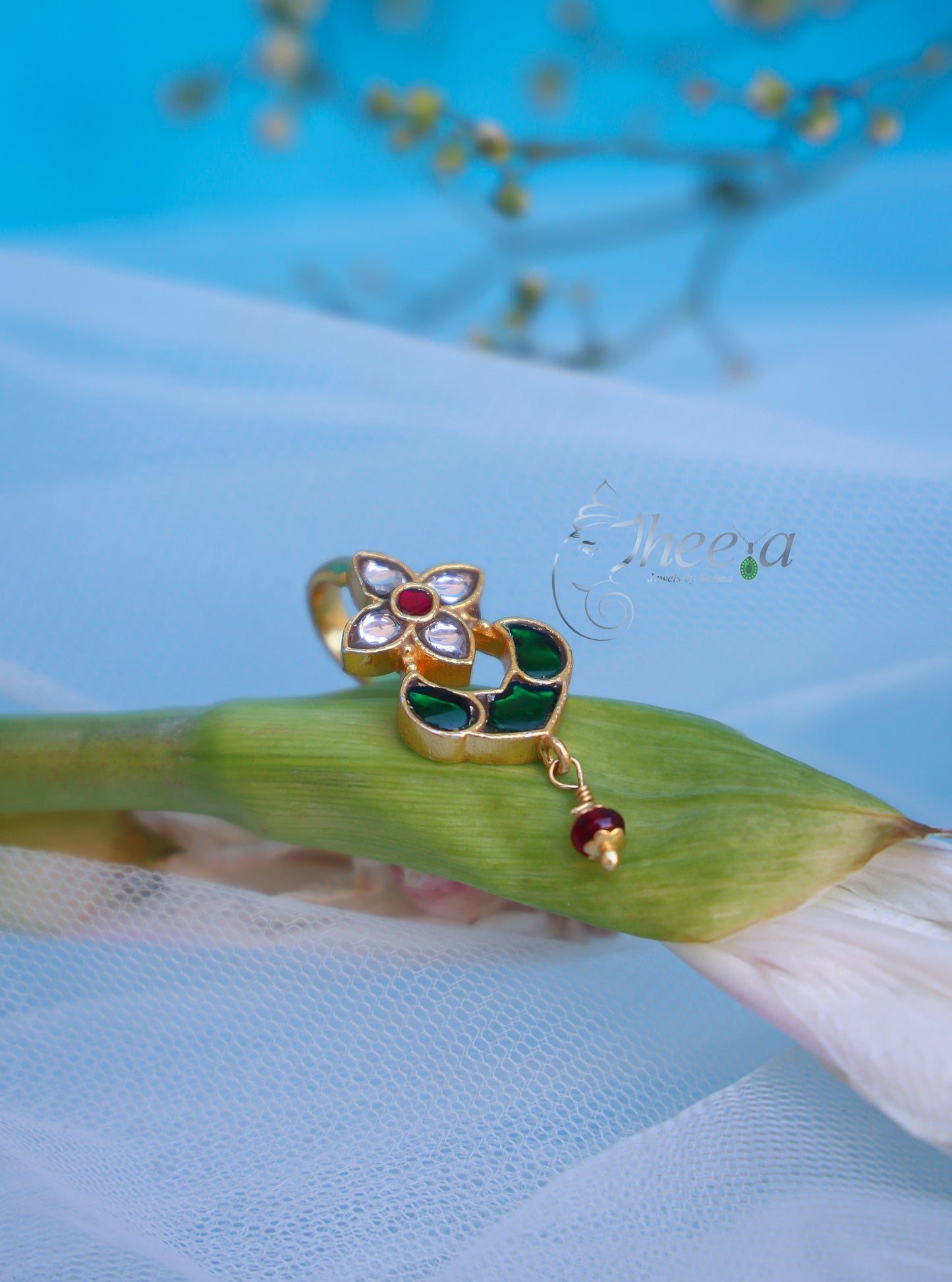 White flower with green bugadi