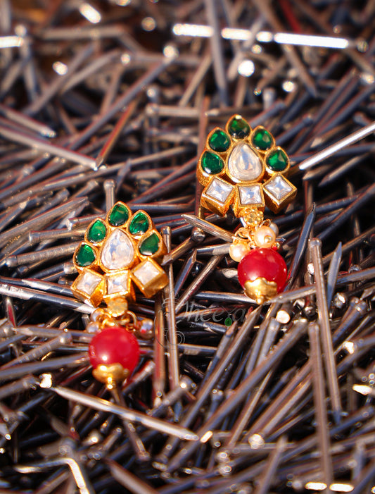 Green and white kundan with red drop