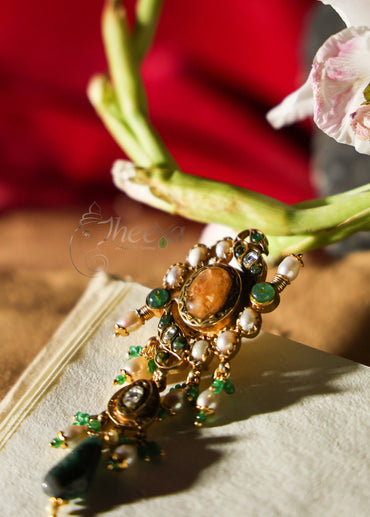 Big yellow stud with greeen bead