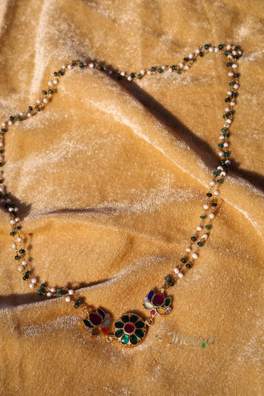 Green kundan pendant with green white beads