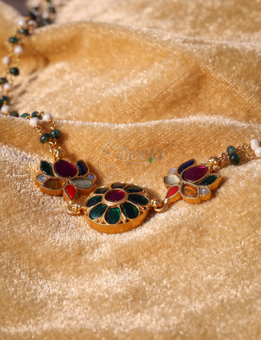 Green kundan pendant with green white beads