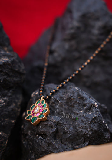 Green lotus with pink with black beads
