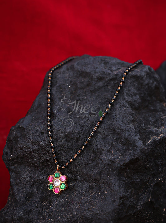 Pink and green flower with black beads