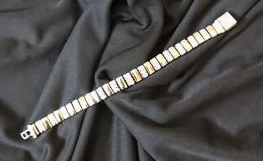 Classic short silver chain for men styling on dark background
