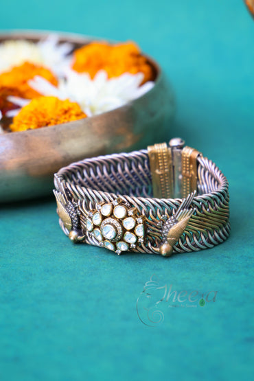 Dual tone Jalebi Bangle with birds and moissanite