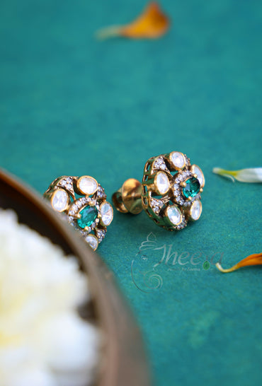Green and moissanaite studs