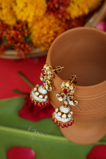 Close-up detailing of Gulnaar Shine Red Flower Jhumkas highlighting Moissanite craftsmanship.