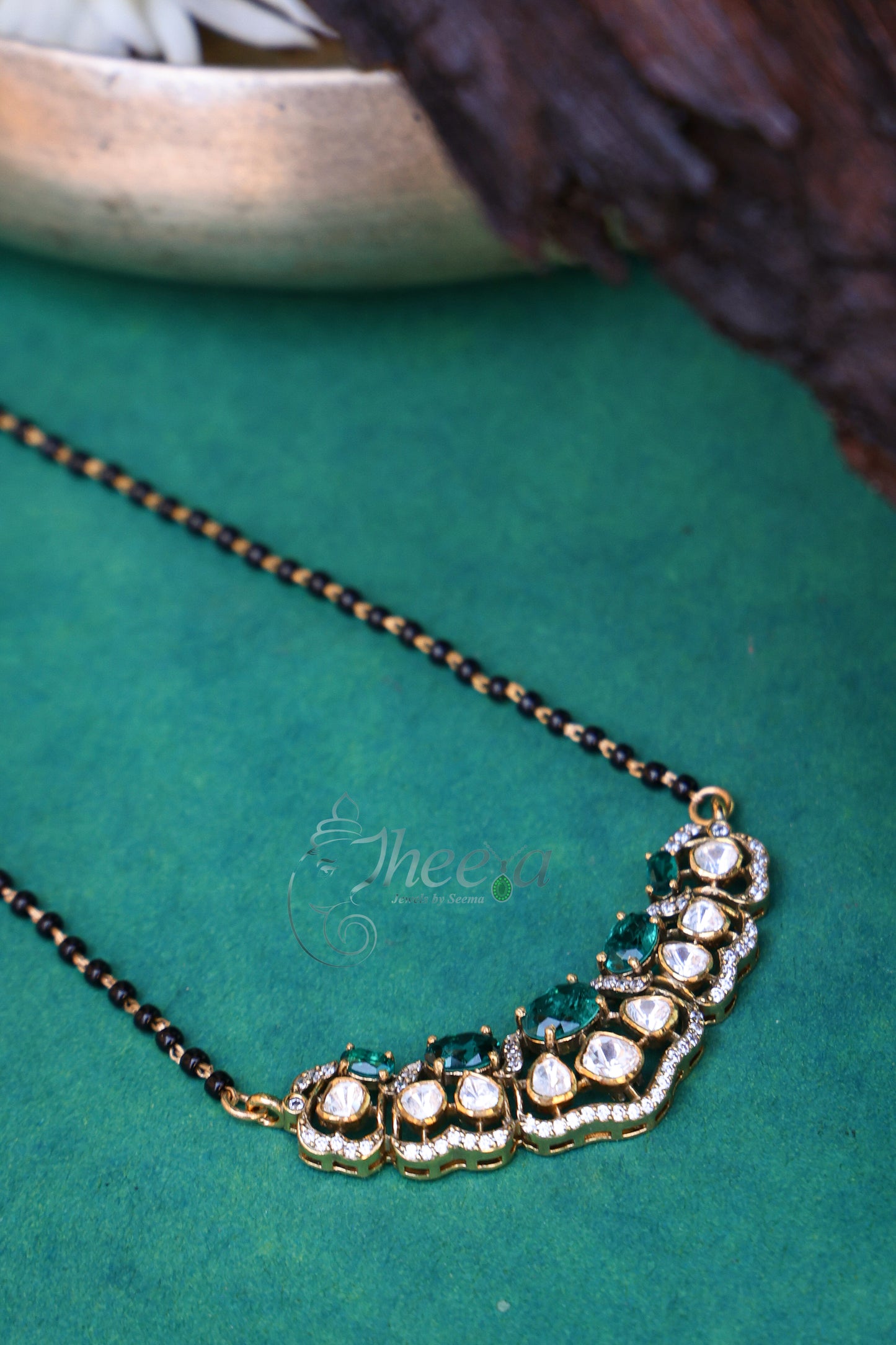 Green and moissanite Pendant with black beads