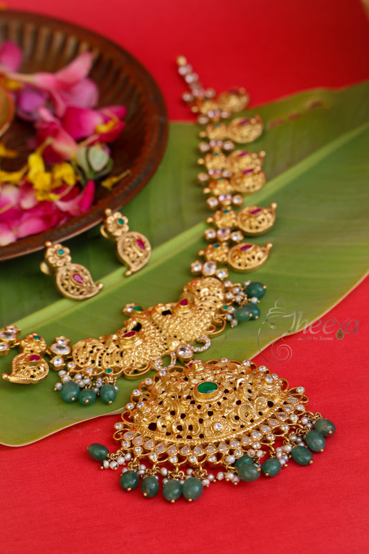 Full view of the Kaveri Gold South Necklace in pure silver, featuring an authentic antique gold finish and vibrant green beaded accents.