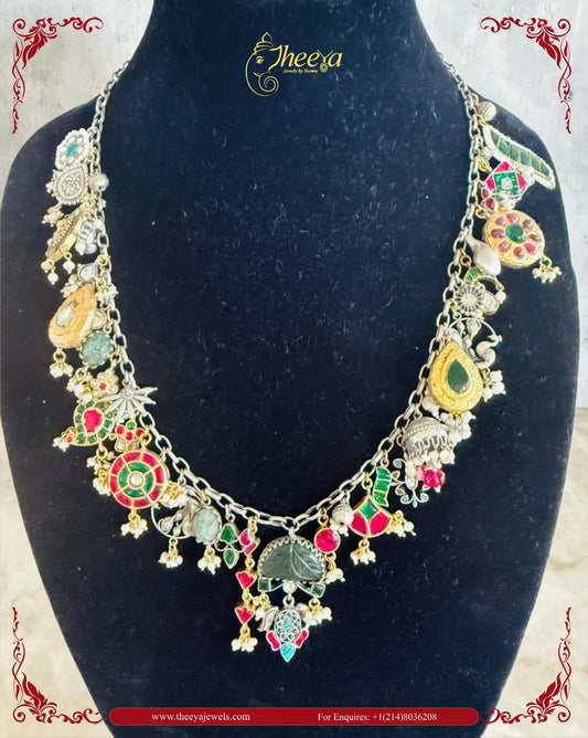 Charm necklace with green stone pendant