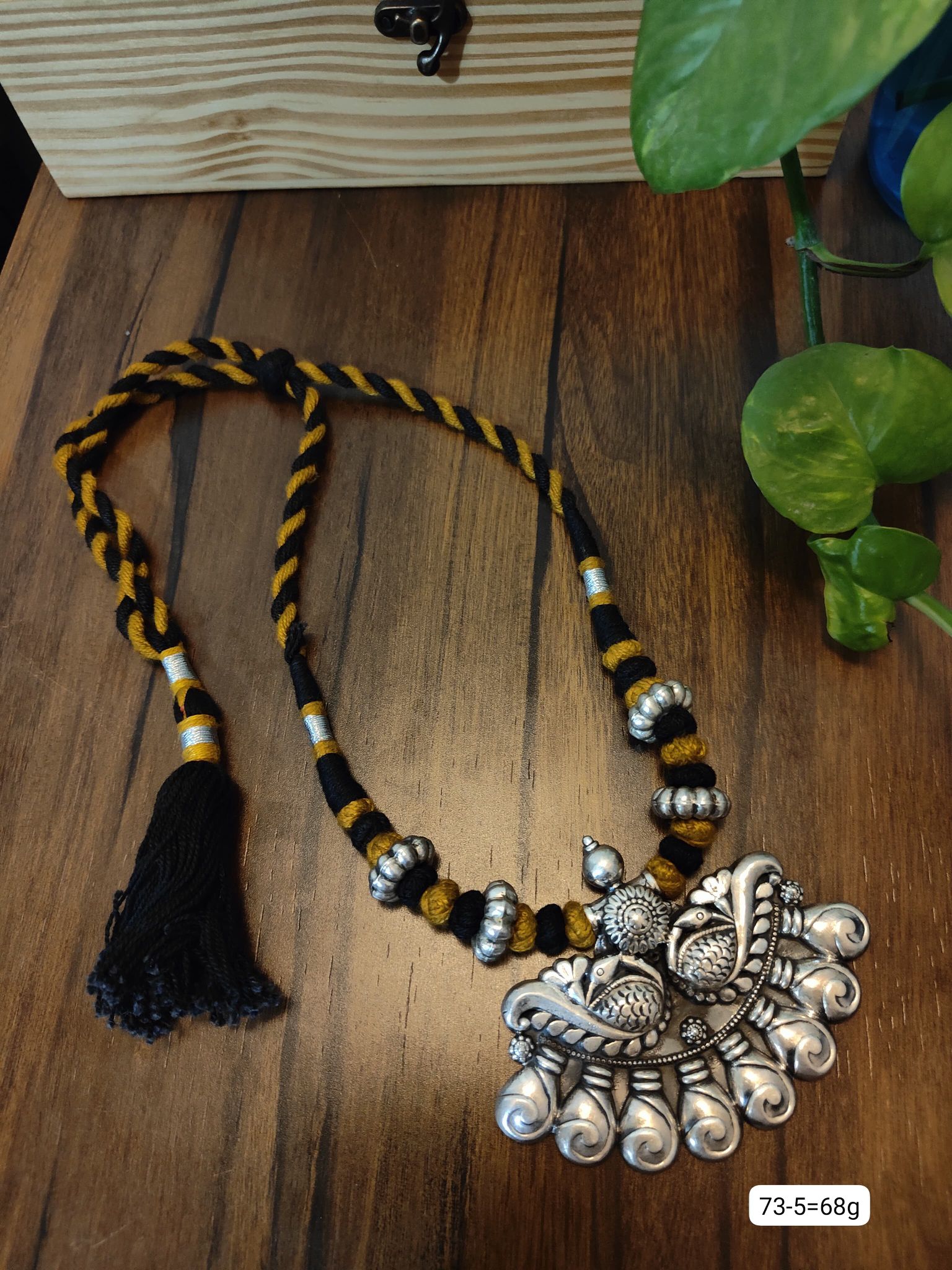 Dhaage Black and yellow peacock pendant image 0