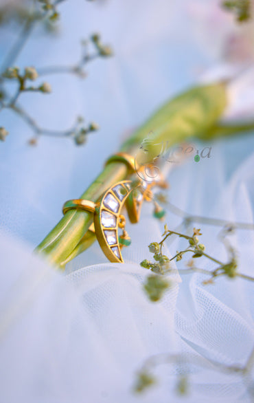 White stone half moon with green drop