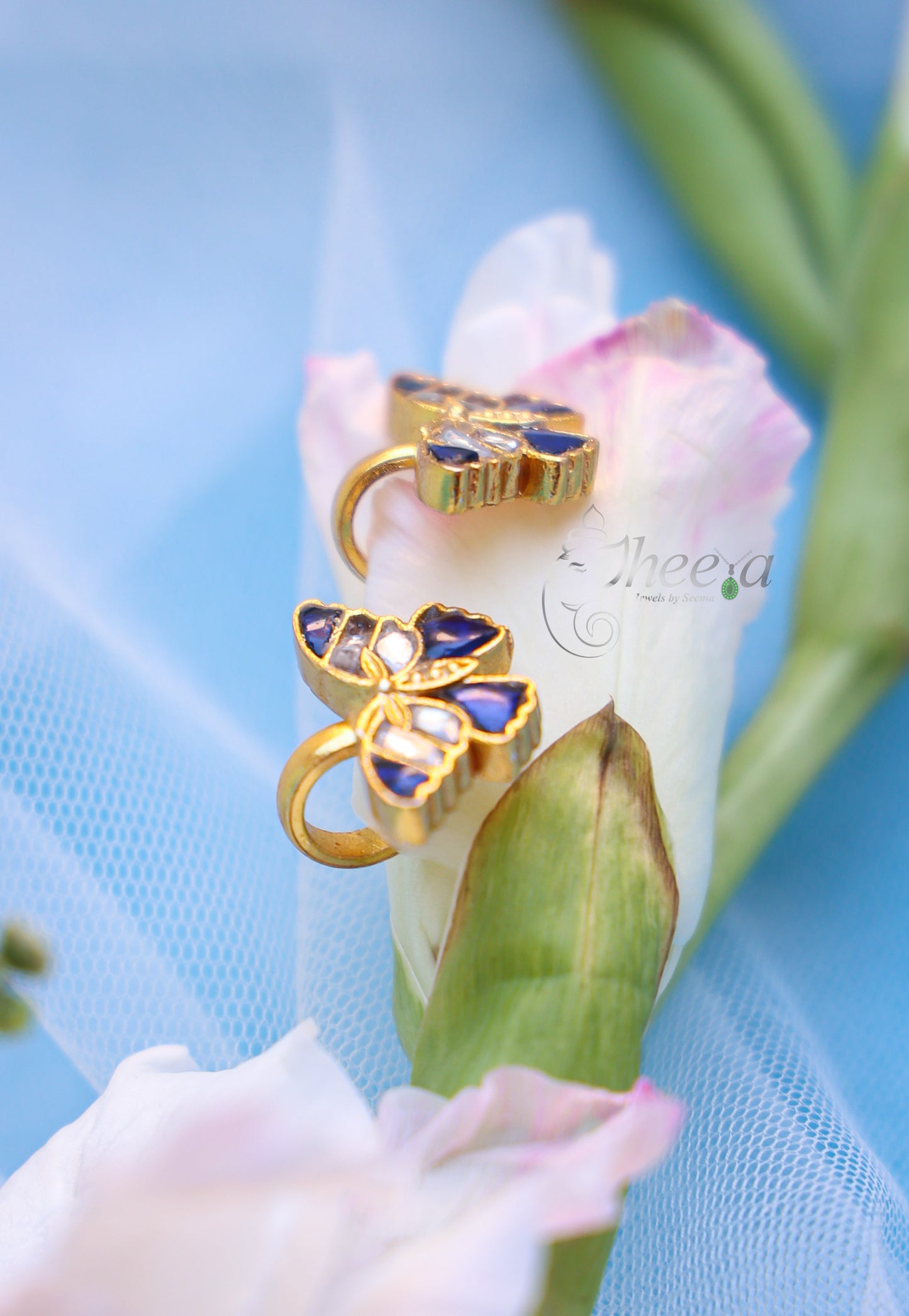 Blue and white butterfly bugadi