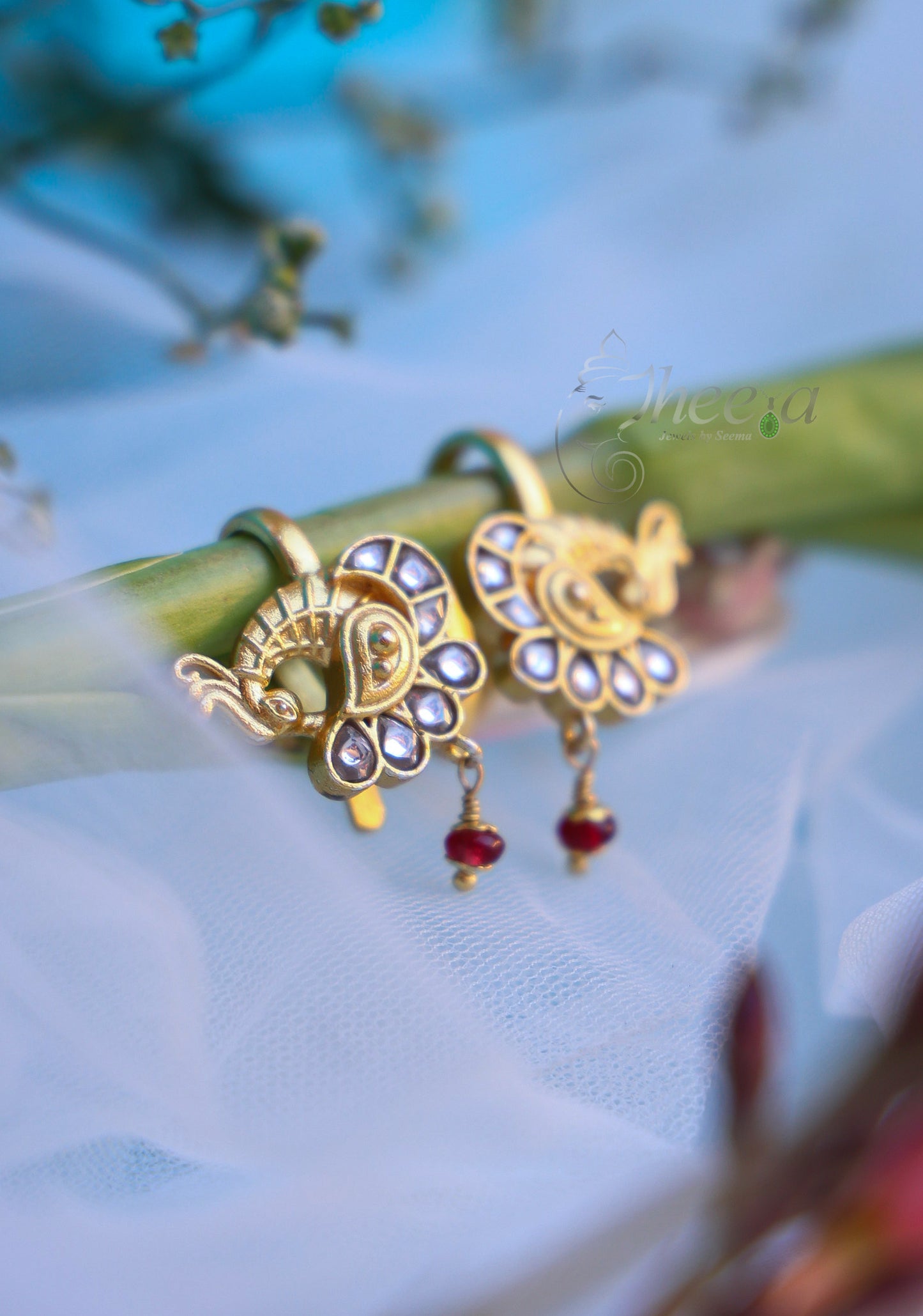 White stone peacock with red bead bugadi