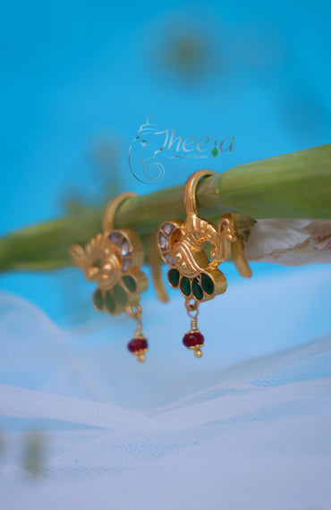 Green stone peacock with red bead bugadi