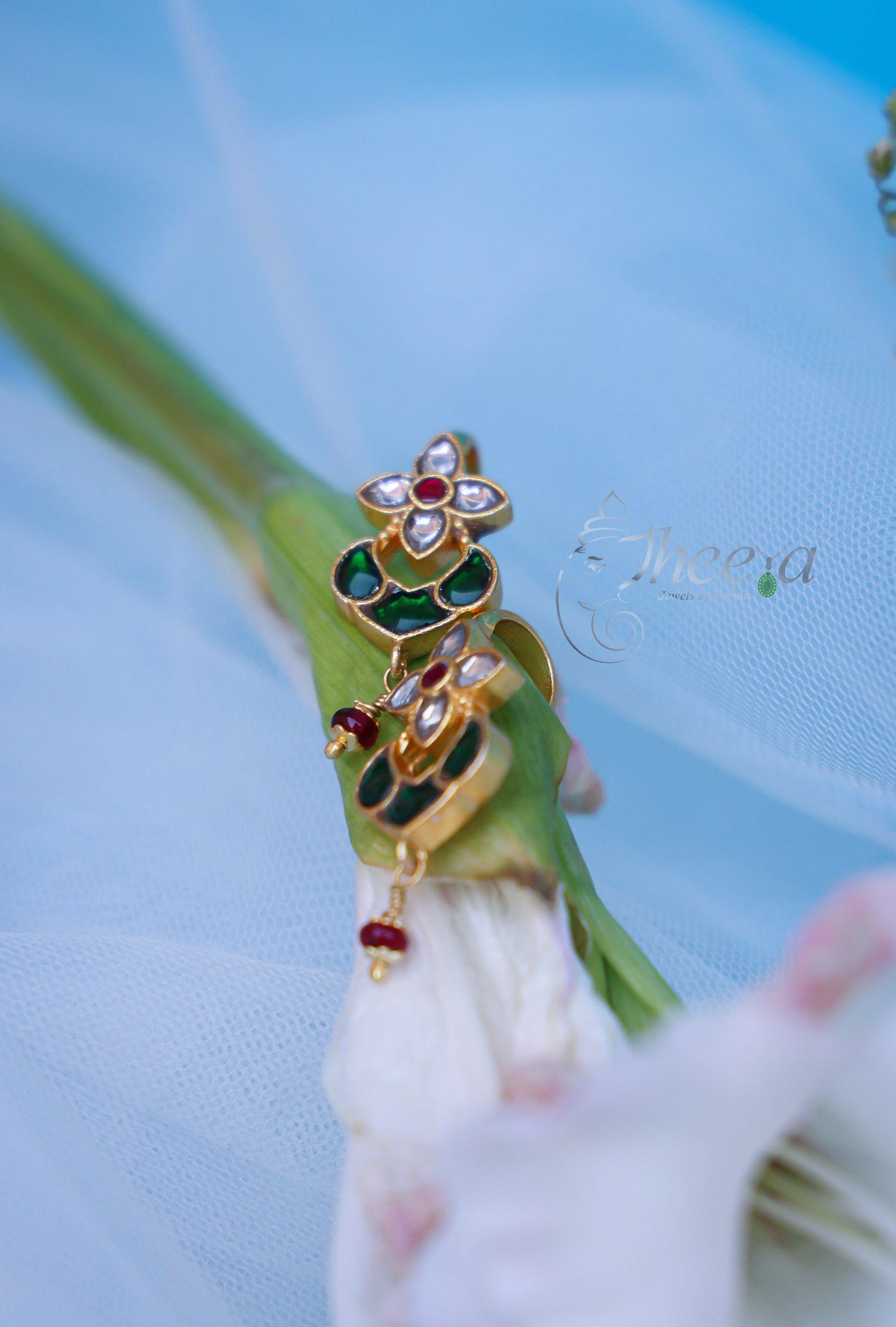 White flower with green bugadi