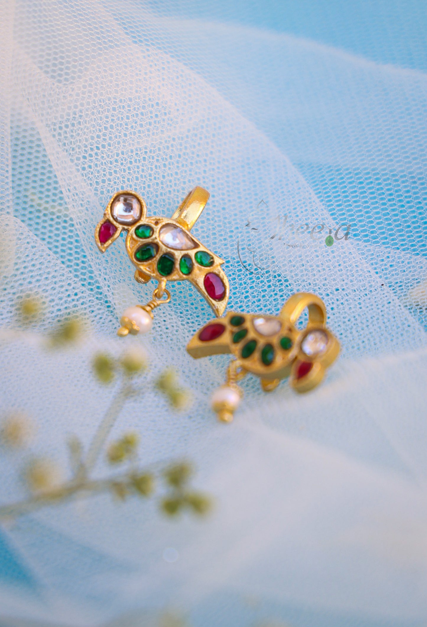 Green bird with red drop bugadi