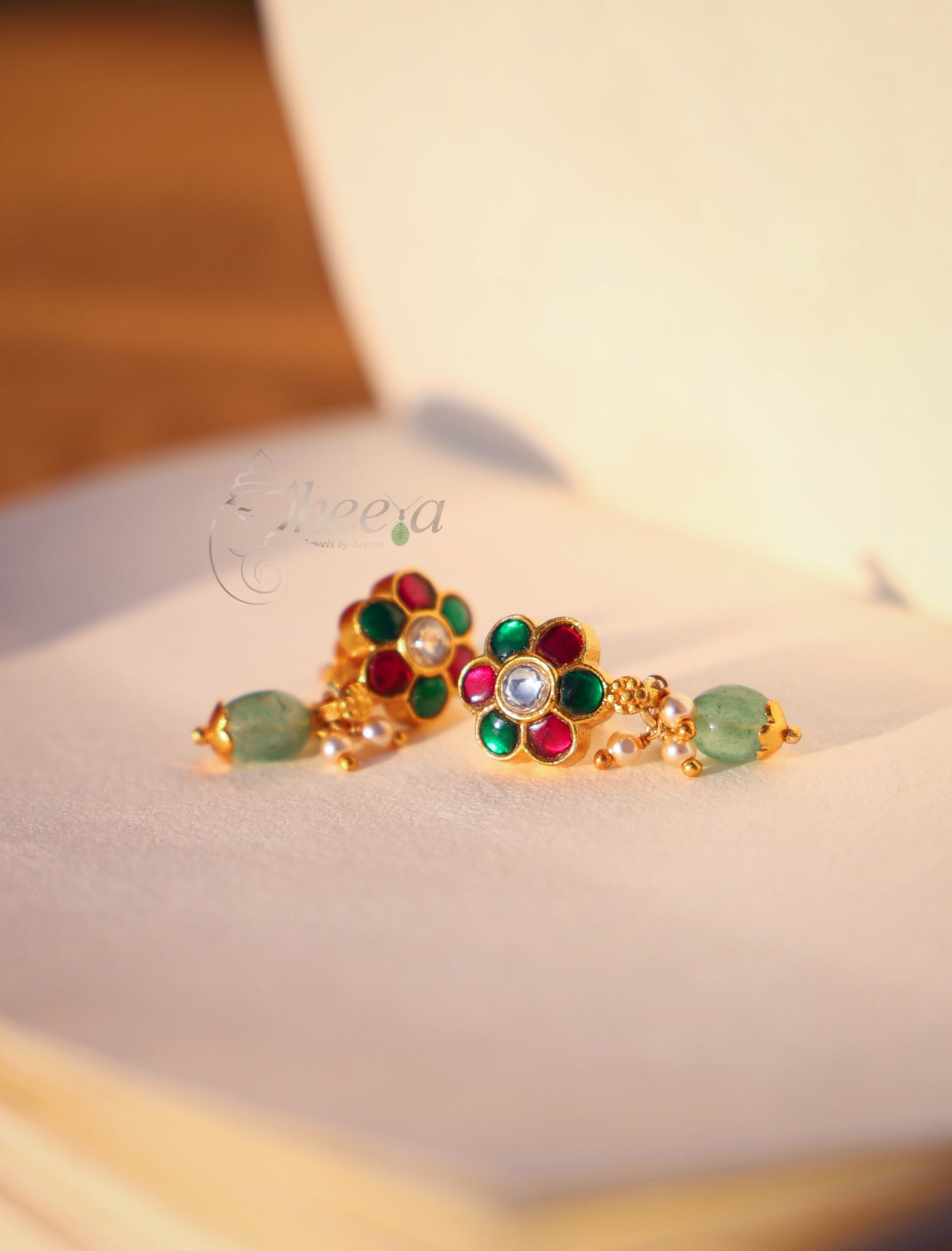 Red green stud with green bead drop
