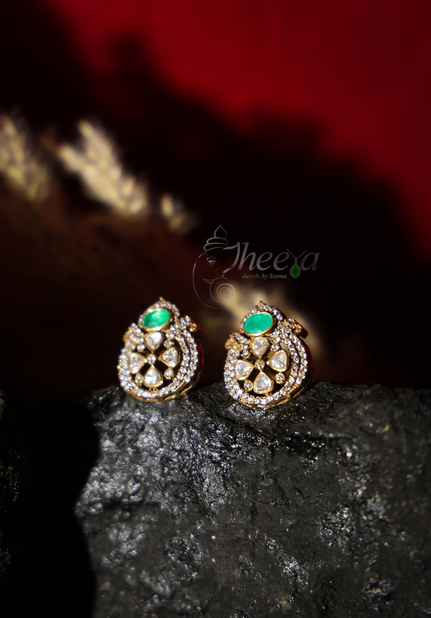small green stone with moissanaite studs