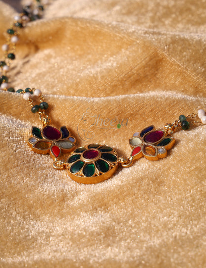 Green kundan pendant with green white beads