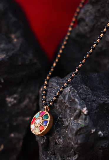 round multi color pendant with black beads