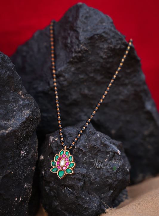 Green lotus with pink with black beads