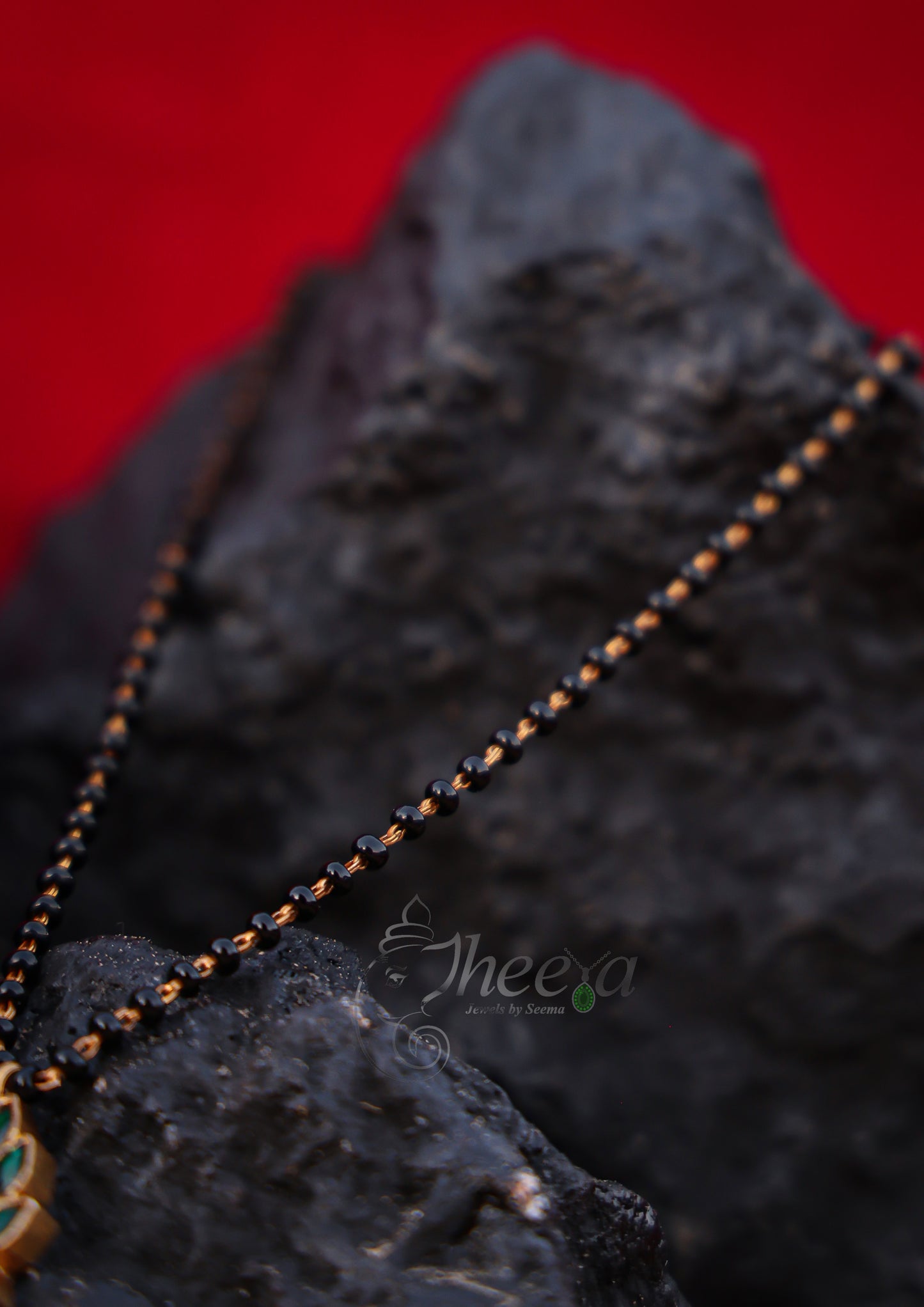 Green lotus with pink with black beads