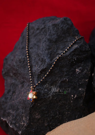 White center multi flower with black beads