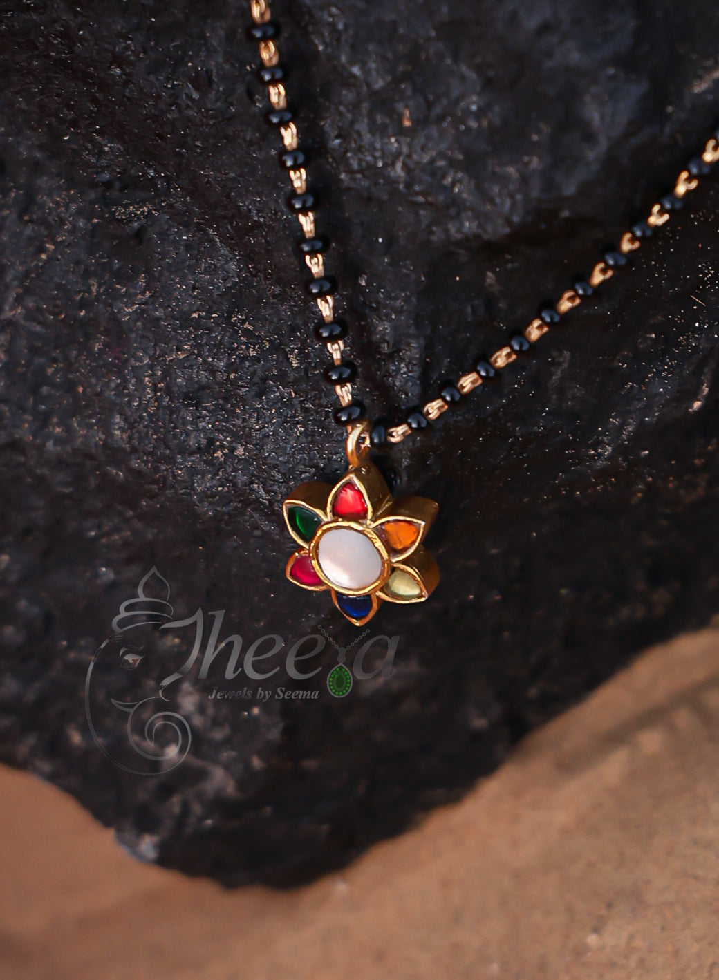 White center multi flower with black beads