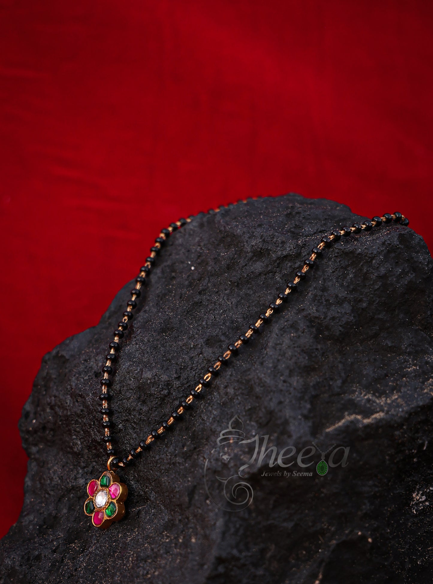 Pink and green flower with black beads