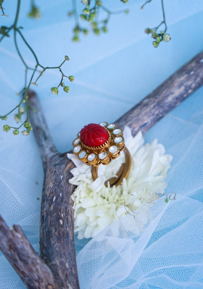 Carved coral ring with moissanite