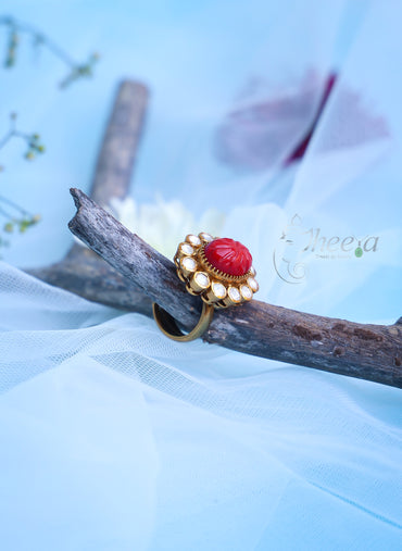 Carved coral ring with moissanite