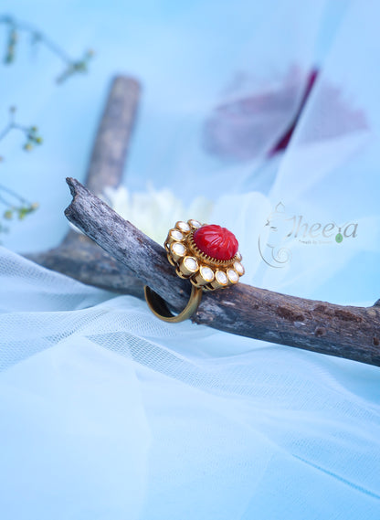 Carved coral ring with moissanite