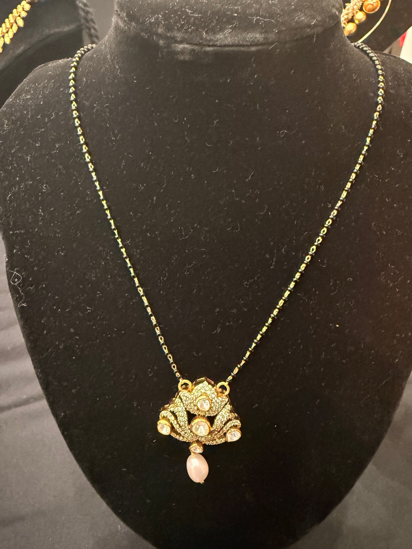 White kundan lotus with black beads