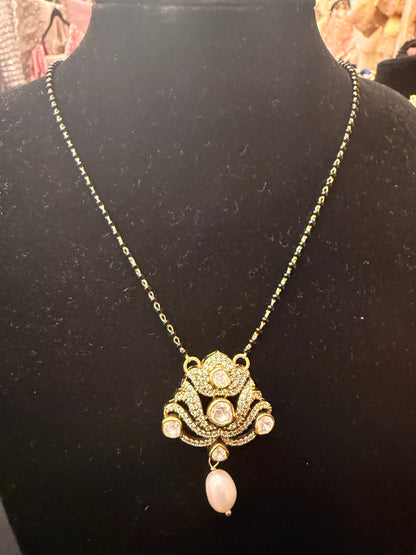 White kundan lotus with black beads