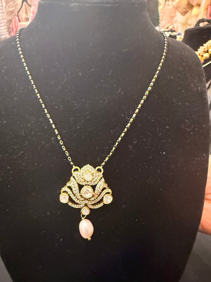 White kundan lotus with black beads