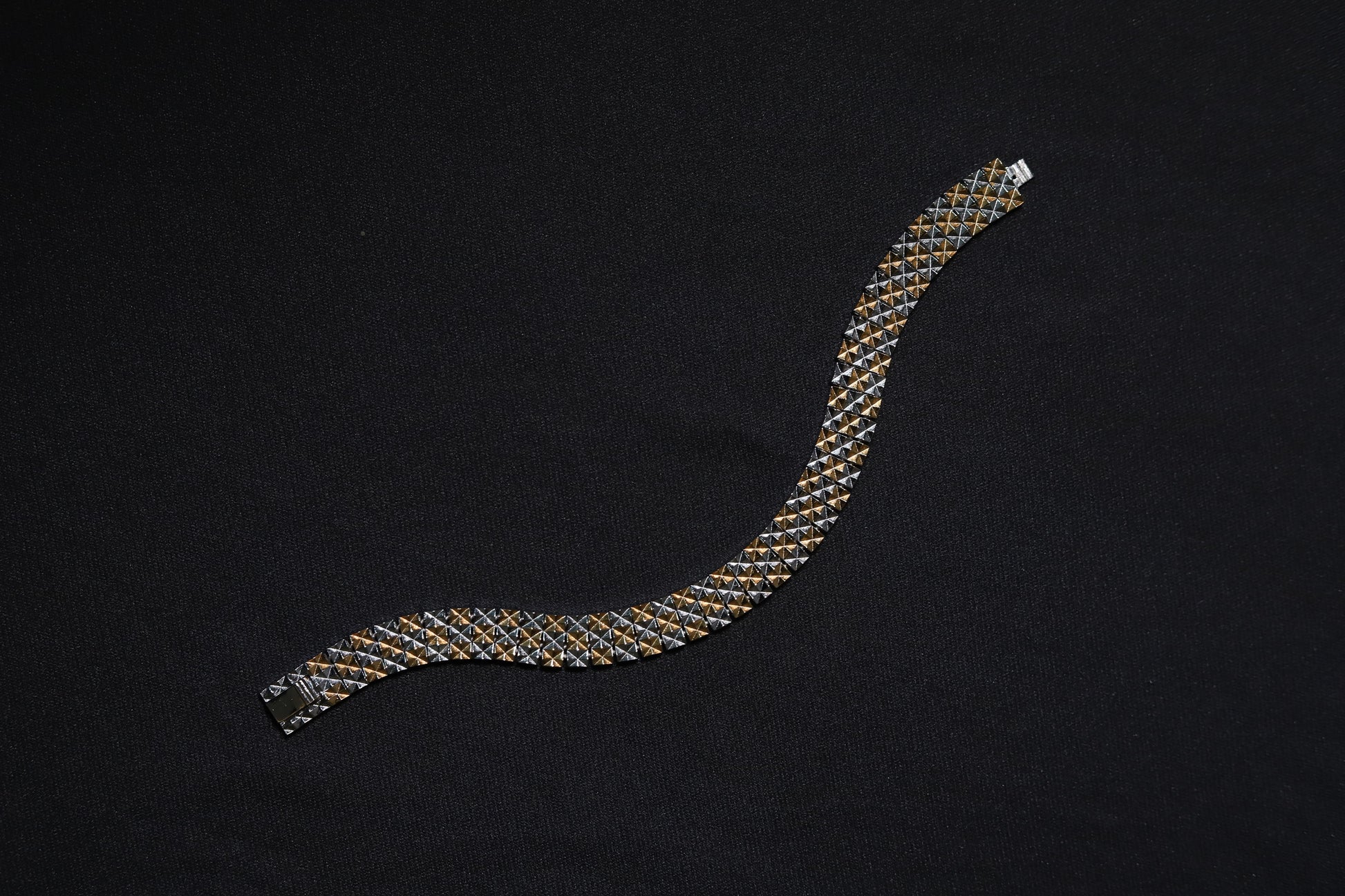 Flat lay of Theeya Jewels silver checkered bracelet for men