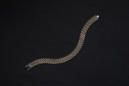 Flat lay of Theeya Jewels silver checkered bracelet for men