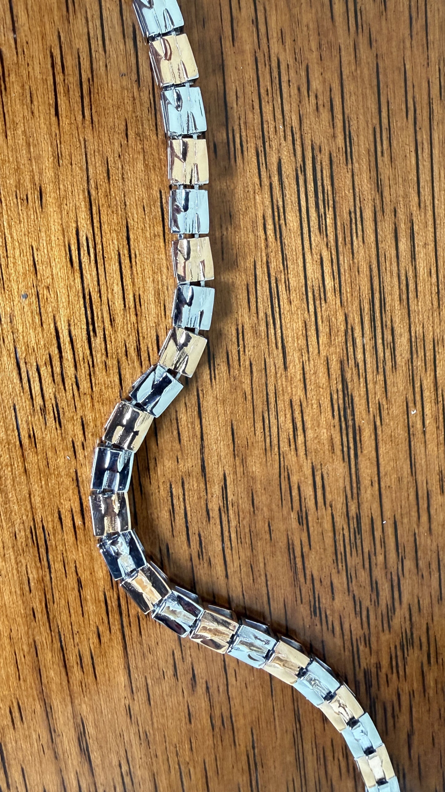 Men's styling featuring the dual tone bracelet with fish hook