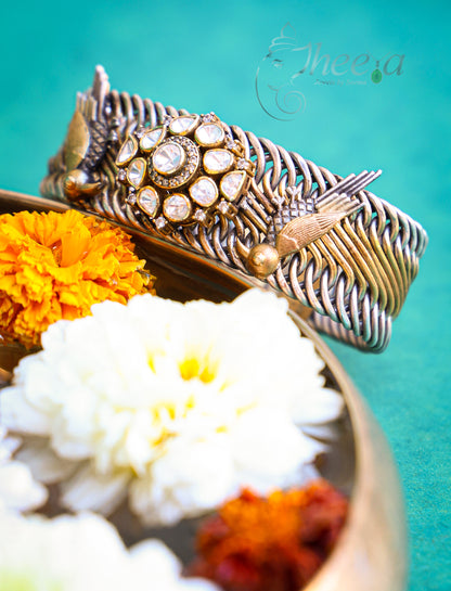 Dual tone Jalebi Bangle with birds and moissanite