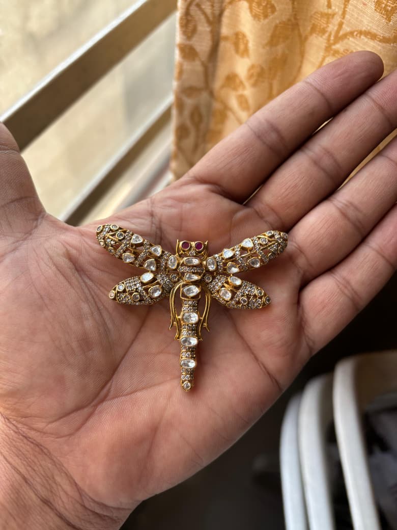Mughal Dragonfly Moissanite Brooch worn by a model showcasing scale and Brooch design.