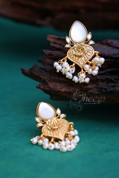 White and gold pear drop earrings