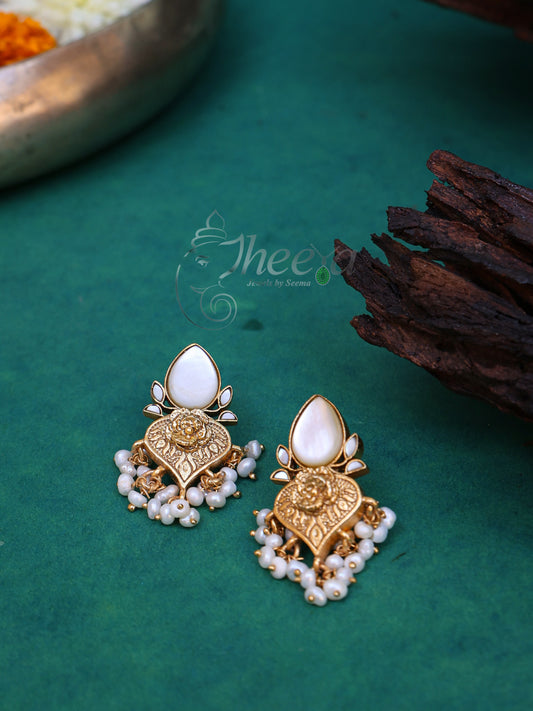 White and gold pear drop earrings