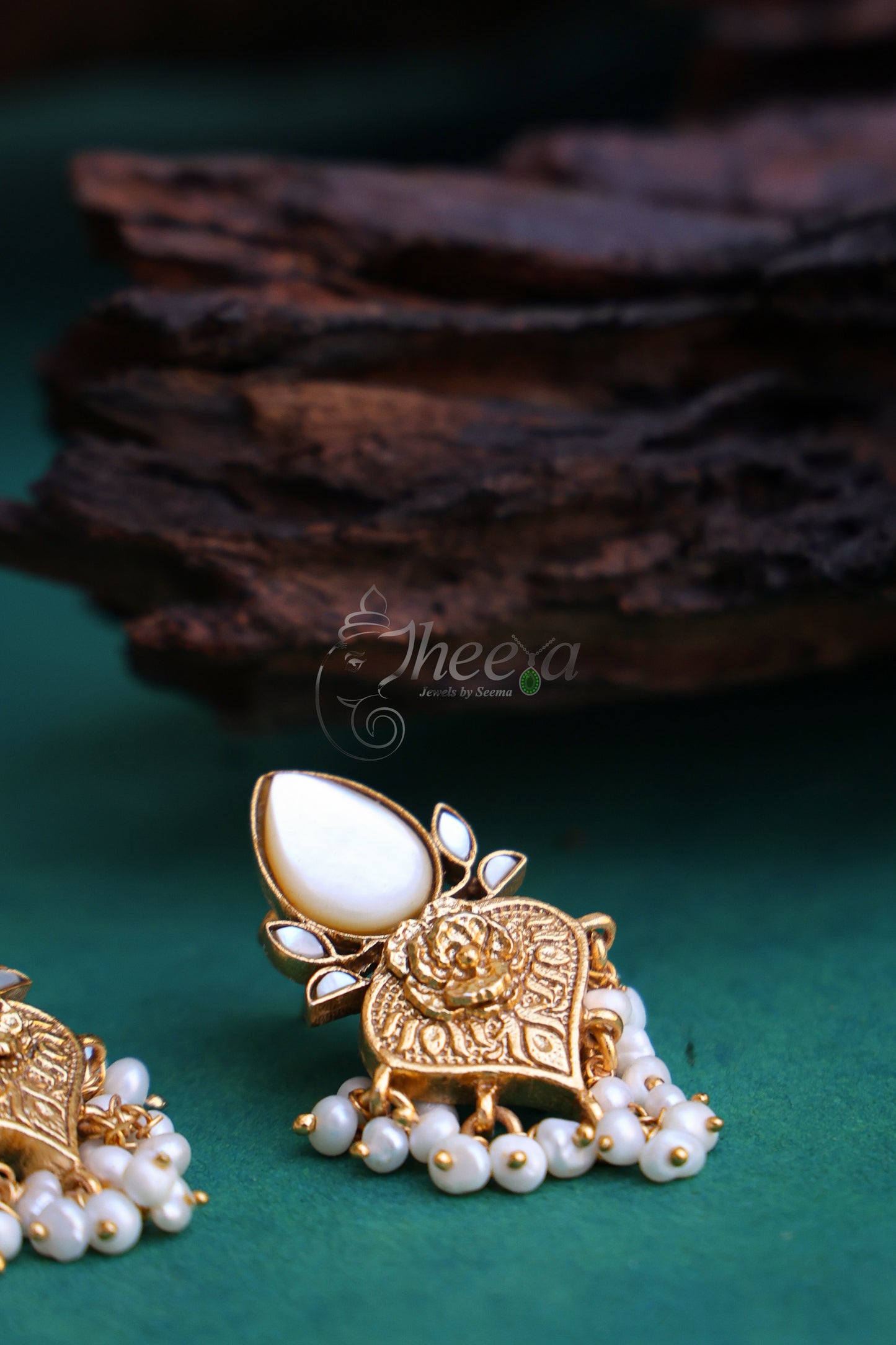 White and gold pear drop earrings