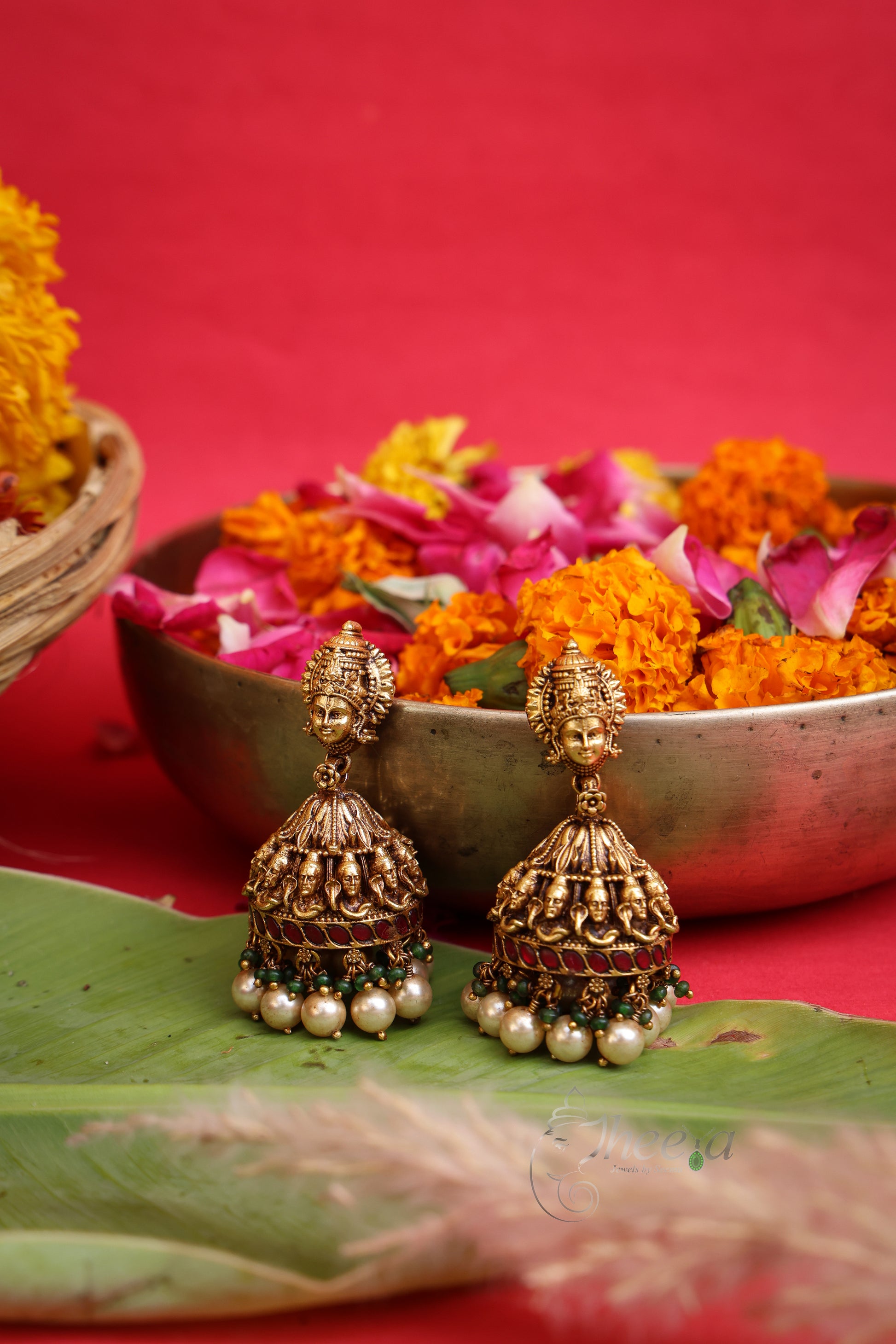 Shivanjali Antique Nakshi Jhumkas worn by a model showcasing scale and Earrings design.