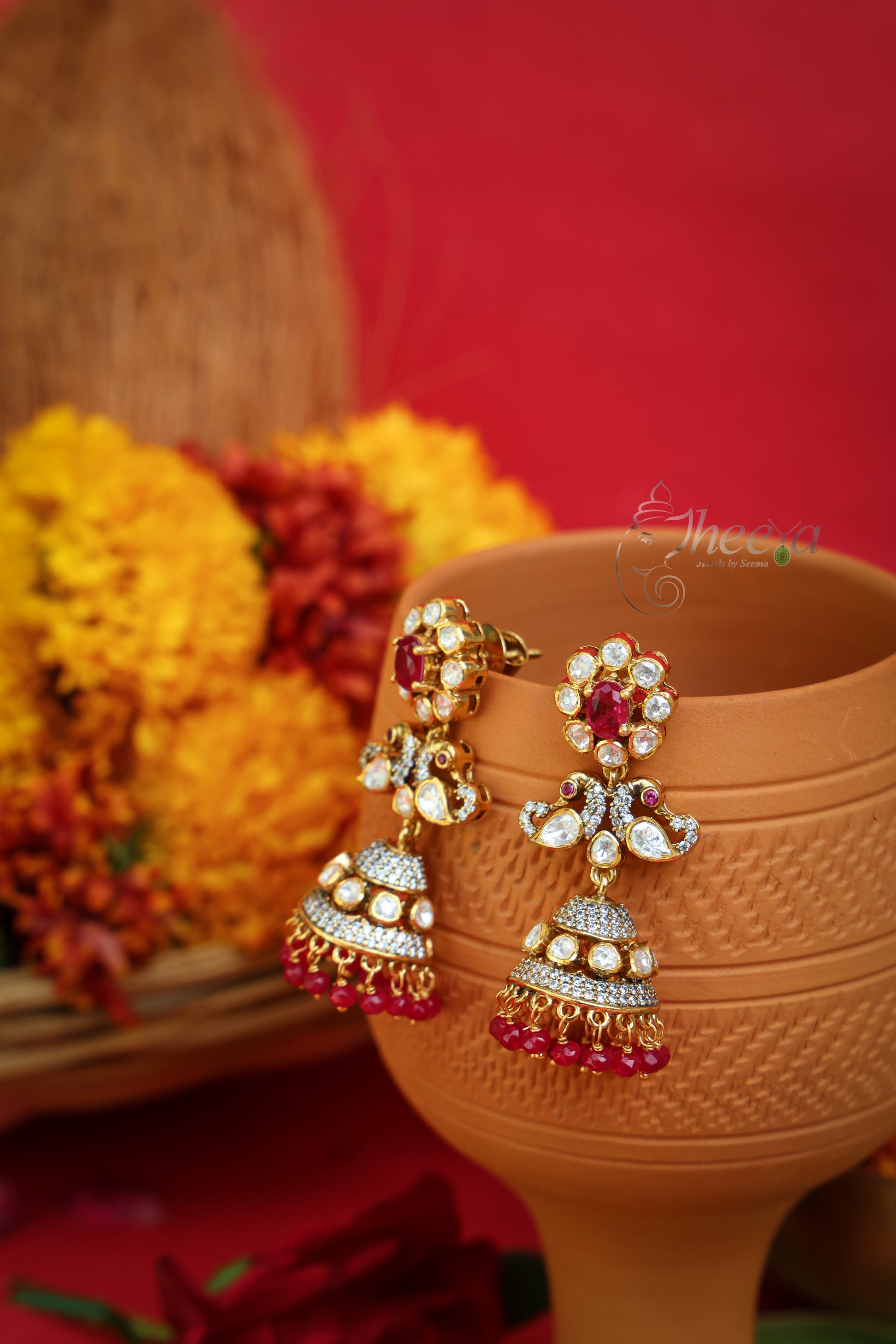 Gulnaar Shine Red Flower Jhumkas worn by a model showcasing scale and Earrings design.