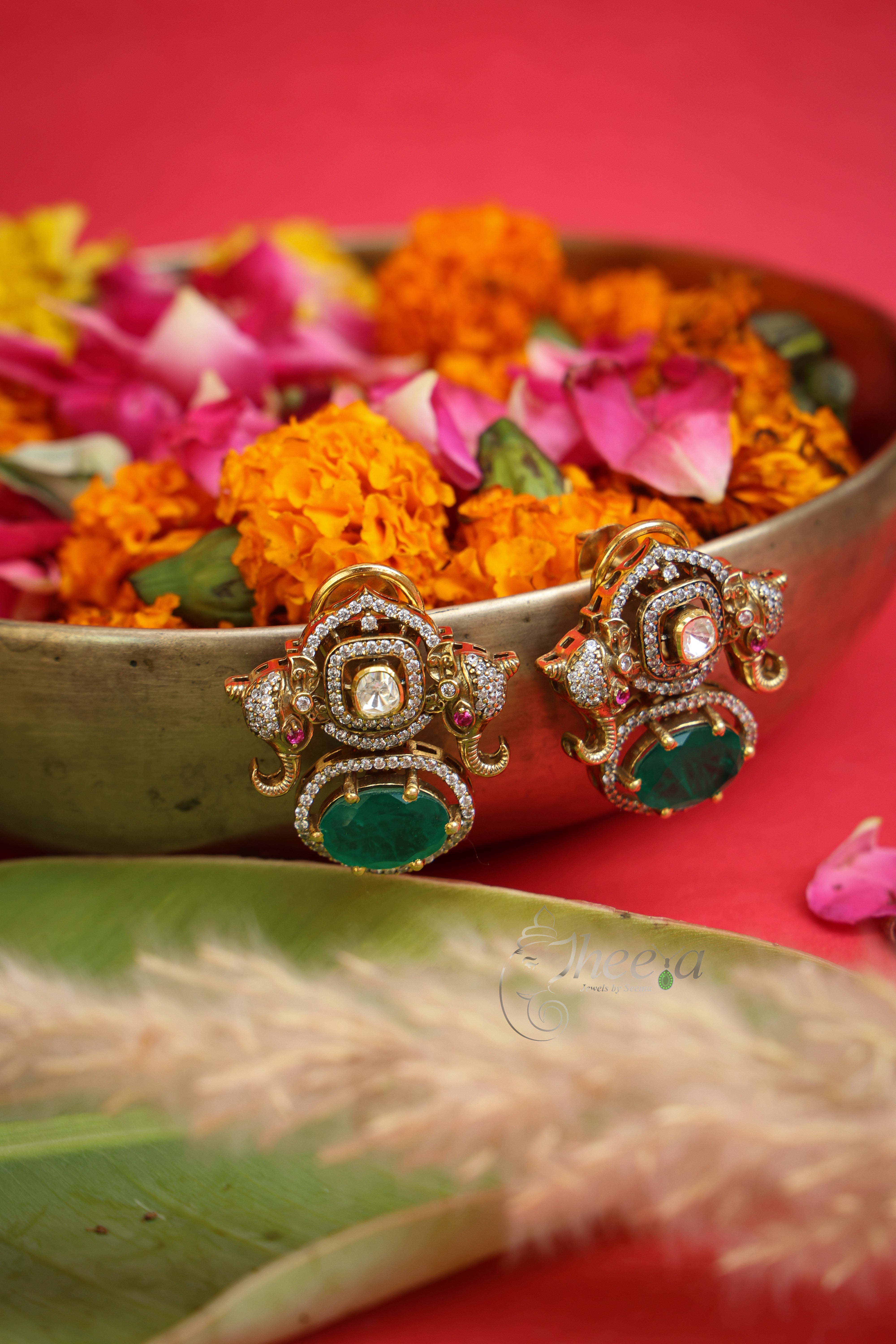 Mrigaya Green Elephant Moissanite Studs in Pure Silver with green accents, front view